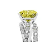 Fancy Yellow Radiant Cut Diamond Solitaire Twist Band Ring Set in White gold with Pavé Setting and Prong Head