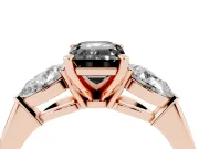 Fancy Black Three-Stone Emerald Cut Diamond Ring Set in Rose gold with Pear Side Stones and Prong Setting