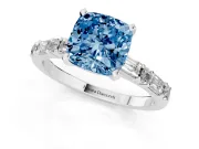 Fancy Blue Cushion Cut Diamond Solitaire Set in White gold with Side Baguettes and Channel Set Band