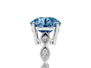 Fancy Blue Round Cut Diamond Solitaire Ring Set in Platinum with Infinity Twist Pavé Band