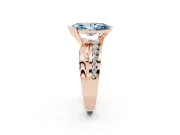 Fancy Blue Marquise Cut Diamond Solitaire Ring Set in Rose gold with Channel Set Split Shank and Tension Prongs