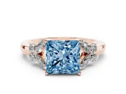 Fancy Blue Princess Cut Diamond Solitaire Floral Ring Set in Rose gold with Marquise Petals and Prong Setting