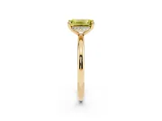 Fancy Yellow Emerald Cut Diamond Solitaire Ring Set in Yellow gold with Thin Band and Prong Setting