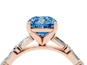 Fancy Blue Cushion Cut Diamond Solitaire Set in Rose gold with Side Baguettes and Channel Set Band
