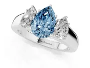 Fancy Blue Three-Stone Pear Cut Diamond Ring Set in Platinum with Matching Prong Settings and Plain Band