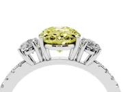 Fancy Yellow Oval Cut Diamond Three-Stone Ring Set in Silver with Pavé Band and Graduated Sides