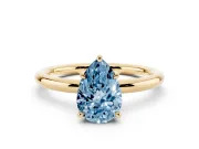 Fancy Blue Pear Cut Diamond Solitaire Ring Set in Yellow gold with Thin Band and Prong Setting