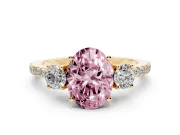 Fancy Pink Oval Cut Diamond Three-Stone Ring Set in Yellow gold with Pavé Band and Graduated Sides