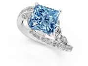 Fancy Blue Princess Cut Diamond Solitaire Ring Set in Platinum with Pavé Twist Band and Secure Prong Setting