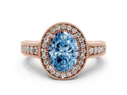 Fancy Blue Oval Cut Diamond Halo Ring Set in Rose gold with Round Accent Halo, Pavé Band and Prong Setting