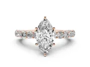 Marquise Cut Diamond Solitaire Ring Set in Rose gold with Shared Prong Pavé Band