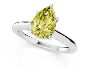 Fancy Yellow Pear Cut Diamond Solitaire Ring Set in Platinum with Cathedral Band and Prong Setting
