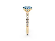 Fancy Blue Oval Cut Diamond Solitaire Ring Set in Yellow gold with Round Pavé Band and Prong Setting
