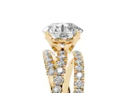 Round Cut Diamond Solitaire Twist Band Ring Set in Yellow gold with Pavé Setting and Prong Head
