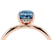 Fancy Blue Emerald Cut Diamond Solitaire Engagement Ring Set in Rose gold with Prong Setting and Polished Band