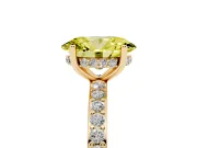 Fancy Yellow Oval Cut Diamond Pavé Band Ring Set in Yellow gold with Prong-Set Center Stone