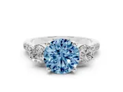 Fancy Blue Three-Stone Round Cut Diamond Pavé Band Ring Set in Platinum with Prong-Set Trio