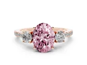 Fancy Pink Oval Cut Diamond Three-Stone Ring Set in Rose gold with Pavé Band and Graduated Sides