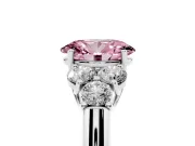 Fancy Pink Oval Cut Diamond Cluster Ring Set in Silver with Round Accent Stones and Prong Setting on a Plain Band