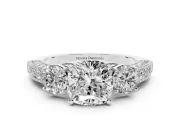 Cushion Cut Diamond Three-Stone Ring Set in White gold with Round Side Stones and Pavé Band