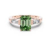 Fancy Green Emerald Cut Diamond Solitaire Ring Set in Rose gold with Tapered Baguette Side Stones and Prong Setting