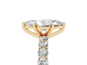 Marquise Cut Diamond Solitaire Ring Set in Yellow gold with Shared Prong Pavé Band