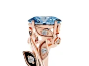 Fancy Blue Oval Cut Diamond Solitaire Twist Engagement Ring Set in Rose gold with Pavé Leaf Accents