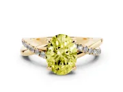 Fancy Yellow Oval Cut Diamond Twist Band Solitaire Set in Yellow gold with Pavé Accents and Prong Setting