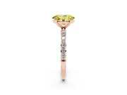 Fancy Yellow Oval Cut Diamond Solitaire Ring Set in Rose gold with Round Pavé Band and Prong Setting