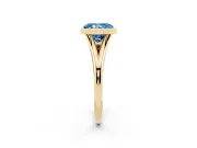 Fancy Blue Bezel Set Radiant Cut Diamond Solitaire Ring Set in Yellow gold with Tapered Band