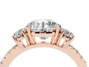Round Cut Diamond Three-Stone Ring Set in Rose gold with Pavé Band and Graduated Sides