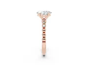 Oval Cut Diamond Solitaire Engagement Ring Set in Rose gold with Bezel Accents on Beaded Band