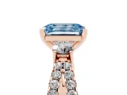 Fancy Blue Emerald Cut Diamond Three-Stone Ring Set in Rose gold with Pavé Split Shank and Prong Setting