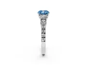 Fancy Blue Cushion Cut Diamond Three-Stone Ring Set in White gold with Round Side Stones and Delicate Pavé Band