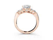 Princess Cut Diamond Cluster Ring Set in Rose gold with Round Accent Stones and Prong Setting on a Plain Band