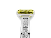 Fancy Yellow Emerald Cut Diamond Solitaire Ring Set in Platinum with Channel-Set Band and Prong Setting