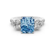 Fancy Blue Three-Stone Radiant Cut Diamond Pavé Band Ring Set in White gold with Prong-Set Trio