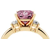 Fancy Pink Three-Stone Princess Cut Diamond Ring Set in Yellow gold with Prong Setting and Plain Band