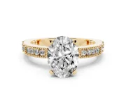 Oval Cut Diamond Solitaire Ring Set in Yellow gold with Slim Pavé Band and Prong Setting