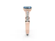 Fancy Blue Emerald Cut Diamond Solitaire Ring Set in Rose gold with Channel-Set Band and Prong Setting