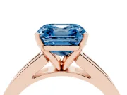 Fancy Blue Asscher Cut Diamond Solitaire Ring Set in Rose gold with Channel-Set Band and Prong Setting