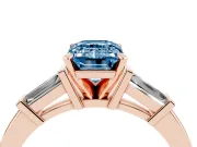 Fancy Blue Emerald Cut Diamond Solitaire Ring Set in Rose gold with Tapered Baguette Accents and Prong Setting