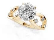 Round Cut Diamond Solitaire Ring Set in Yellow gold with Side Stones on Criss-Cross Band and Prong Setting