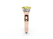 Fancy Yellow Three-Stone Oval Cut Diamond Ring Set in Rose gold with Matching Prong Settings and Plain Band