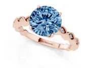 Fancy Blue Round Cut Diamond Solitaire Ring Set in Rose gold with Infinity Twist Pavé Band