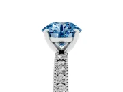 Fancy Blue Round Cut Diamond Solitaire Ring Set in White gold with Slim Pavé Band and Prong Setting