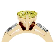 Fancy Yellow Heart Cut Diamond Solitaire Ring Set in Yellow gold with Tapered Baguette Side Stones and Prong Setting