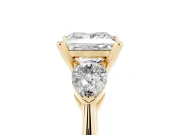 Three-Stone Princess Cut Diamond Ring Set in Yellow gold with Pear Side Stones and Prong Setting