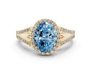 Fancy Blue Oval Cut Diamond Halo Split Shank Pavé Ring Set in Yellow gold with Prong Setting