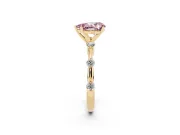 Fancy Pink Pear Cut Diamond Solitaire Ring Set in Yellow gold with Bezel Set Side Stones and Prong Setting
